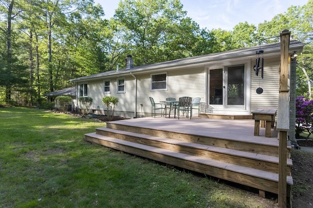 38 Williams Rd, Smithfield, RI 02917 - rear view of house with a yard, a wooden deck, and outdoor dining area