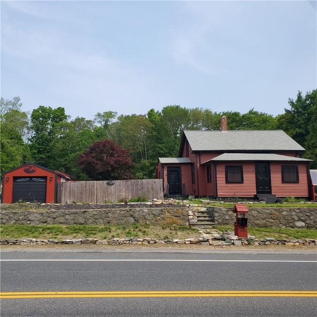 199 Plainfield Pike, Scituate, RI 02857 - view of front of house featuring a chimney and roof with shingles