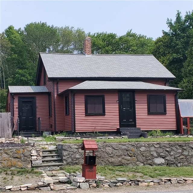 199 Plainfield Pike, Scituate, RI 02857 - rustic home with a chimney, entry steps, and roof with shingles
