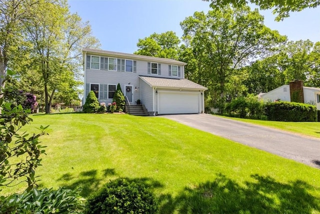 46 Lincoln Dr, Johnston, RI 02919 - colonial home with an attached garage, driveway, and a front yard