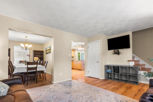 46 Lincoln Dr, Johnston, RI 02919 - living room with a chandelier, wood finished floors, and plenty of natural light