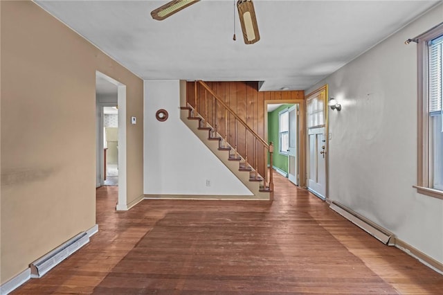 16 King Rd, Middletown, RI 02842 - foyer featuring baseboard heating, ceiling fan, wood finished floors, stairway, and baseboards