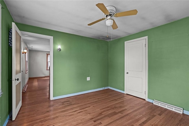 16 King Rd, Middletown, RI 02842 - unfurnished room with wood finished floors, baseboards, and a ceiling fan
