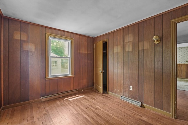 16 King Rd, Middletown, RI 02842 - unfurnished room with baseboard heating, wood-type flooring, and wood walls
