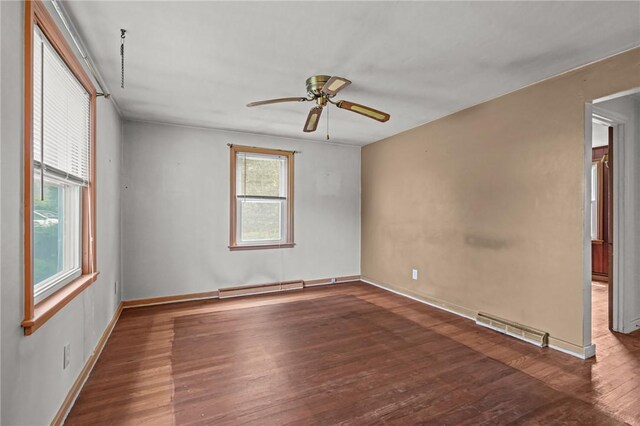 16 King Rd, Middletown, RI 02842 - empty room featuring baseboard heating, wood finished floors, ceiling fan, and baseboards