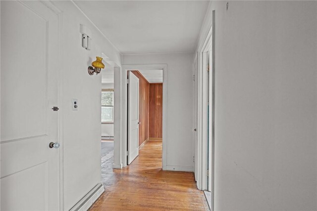 16 King Rd, Middletown, RI 02842 - hall with light wood finished floors, a baseboard heating unit, and baseboards