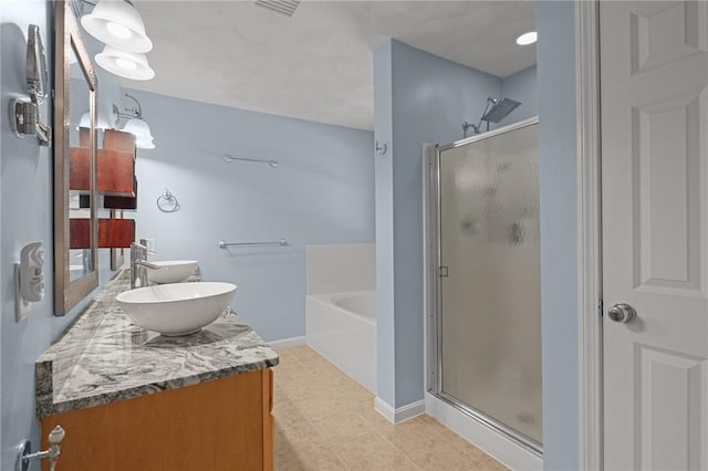 510 Westmoreland Ln, North Kingstown, RI 02874 - full bath with a shower stall, double vanity, a bath, and baseboards