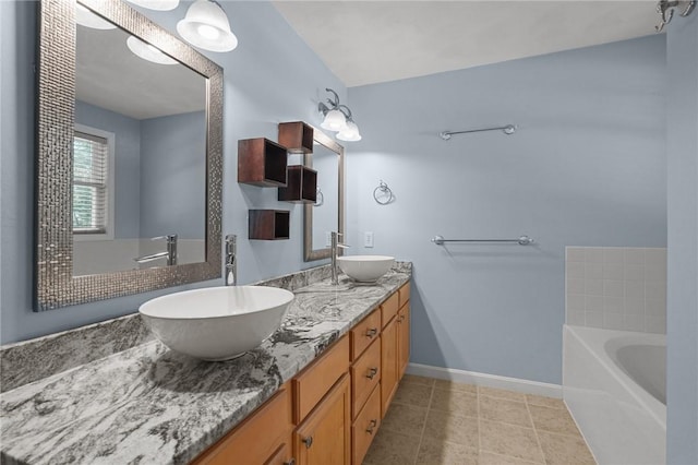 510 Westmoreland Ln, North Kingstown, RI 02874 - full bathroom with a garden tub, double vanity, baseboards, and tile patterned flooring
