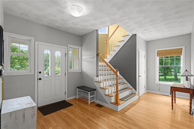 510 Westmoreland Ln, North Kingstown, RI 02874 - entryway with stairs, light wood-style floors, and baseboards