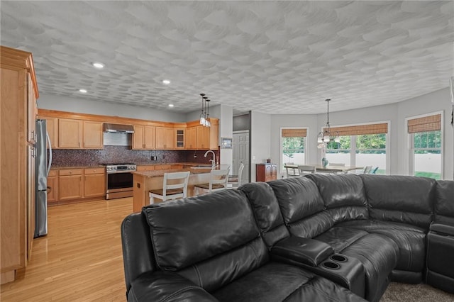 510 Westmoreland Ln, North Kingstown, RI 02874 - living room featuring light wood-style flooring, recessed lighting, and a chandelier