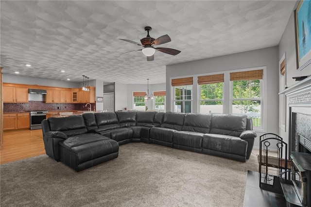 510 Westmoreland Ln, North Kingstown, RI 02874 - living area with ceiling fan, light colored carpet, recessed lighting, and a fireplace
