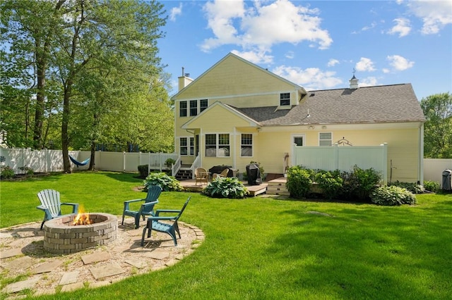 510 Westmoreland Ln, North Kingstown, RI 02874 - rear view of property with an outdoor fire pit, a deck, and a chimney