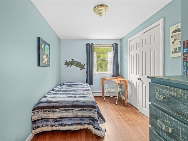 860 Centerville Rd, Warwick, RI 02886 - bedroom with wood finished floors, a closet, and baseboards