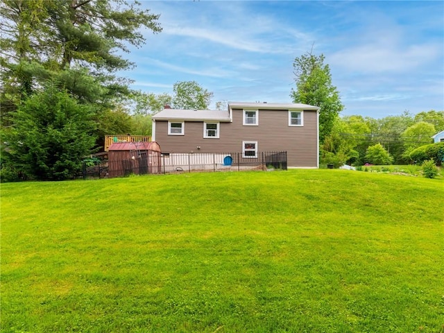 860 Centerville Rd, Warwick, RI 02886 - back of property with a yard, a deck, and a chimney
