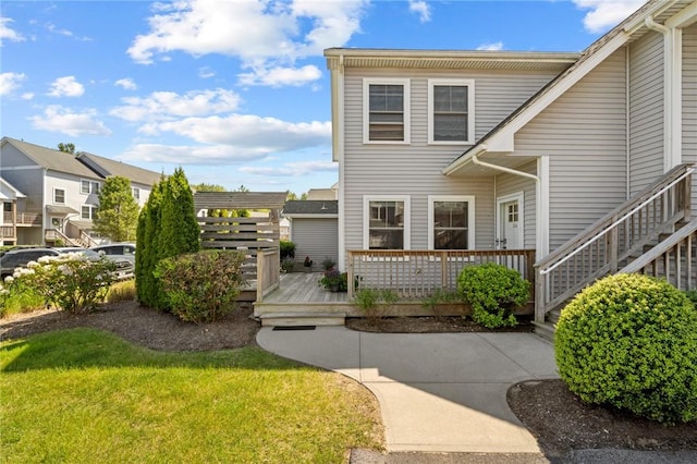 2 Jupiter Ln Unit A, Richmond, RI 02898 - view of front facade with a deck and a front lawn