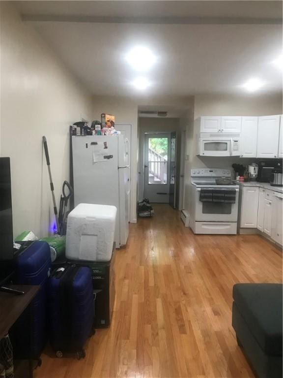 72 Mercy St, Providence, RI 02909 - kitchen featuring white appliances, light wood-style floors, and white cabinets
