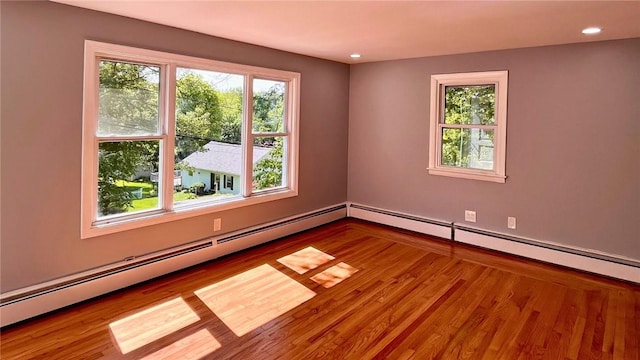 106 Leigh Rd, Cumberland, RI 02864 - spare room featuring healthy amount of natural light, a baseboard heating unit, wood finished floors, and recessed lighting