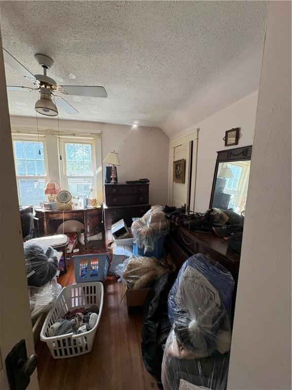 202 Jenckes St, Woonsocket, RI 02895 - bedroom with a textured ceiling, wood-type flooring, lofted ceiling, and a ceiling fan