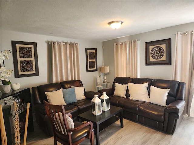 27 Unit St, Providence, RI 02909 - living room featuring light wood-type flooring and a textured ceiling
