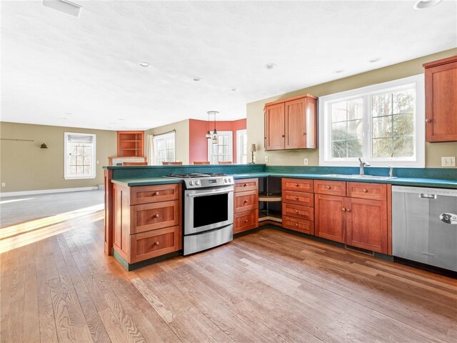 44 Azalea Ave, Exeter, RI 02822 - kitchen with appliances with stainless steel finishes, a sink, a peninsula, light wood finished floors, and recessed lighting