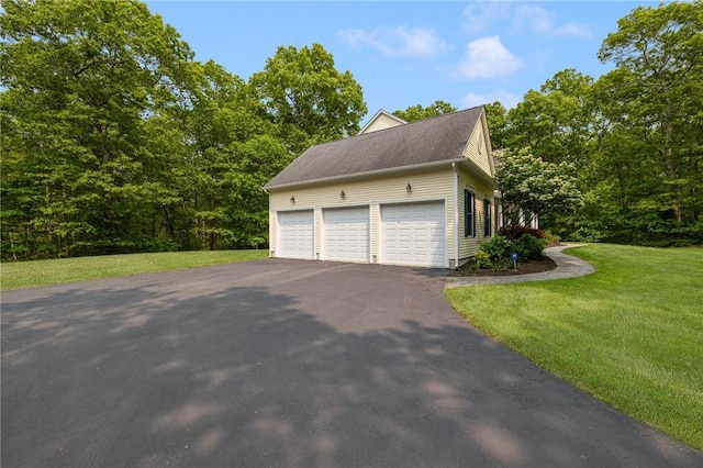 43 Kayla Ricci Way, Exeter, RI 02874 - view of property exterior featuring a lawn, asphalt driveway, and an attached garage