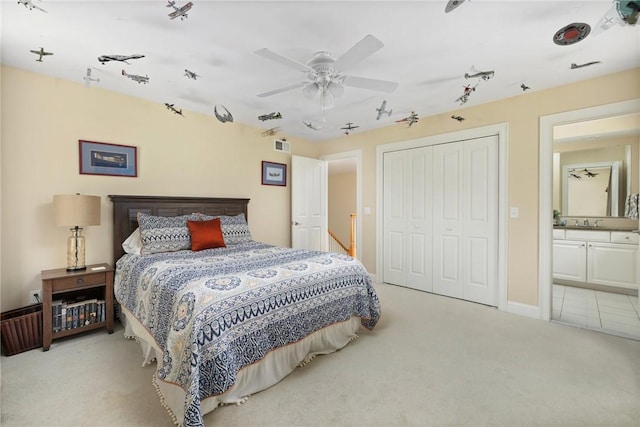 43 Kayla Ricci Way, Exeter, RI 02874 - bedroom featuring light colored carpet, a closet, rail lighting, a ceiling fan, and ensuite bath