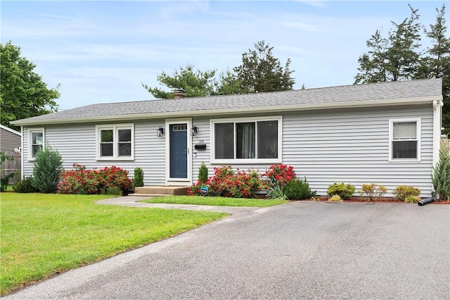 149 Weeden Dr, Warwick, RI 02818 - single story home featuring a front yard and a chimney