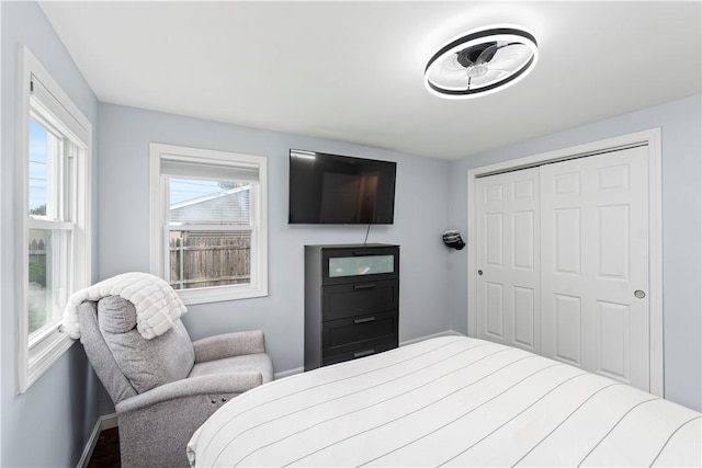 149 Weeden Dr, Warwick, RI 02818 - bedroom with baseboards, a closet, and wood finished floors