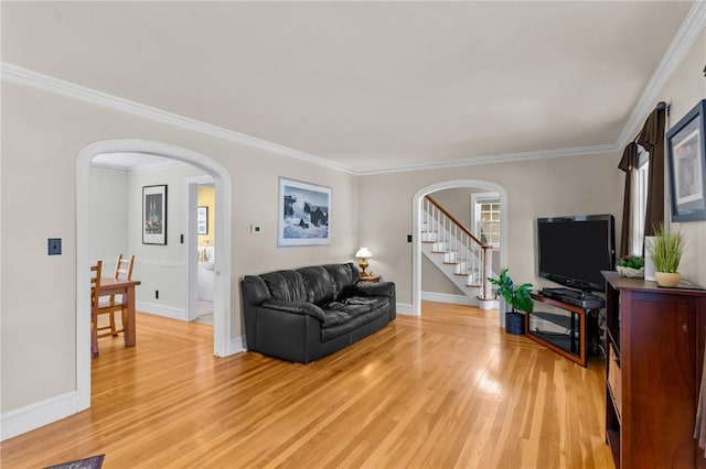 44 Felsmere Ave, Pawtucket, RI 02861 - living room with arched walkways, light wood-style floors, ornamental molding, stairway, and baseboards