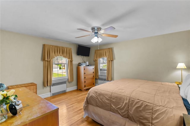 44 Felsmere Ave, Pawtucket, RI 02861 - bedroom featuring radiator heating unit, wood finished floors, baseboards, and cooling unit