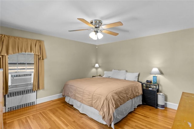 44 Felsmere Ave, Pawtucket, RI 02861 - bedroom featuring radiator, baseboards, and wood finished floors