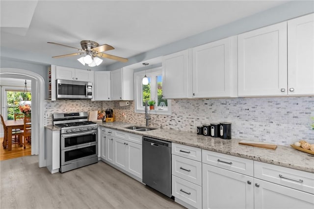44 Felsmere Ave, Pawtucket, RI 02861 - kitchen with stainless steel appliances, a sink, light wood-type flooring, and plenty of natural light