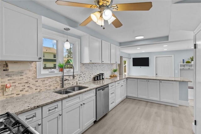 44 Felsmere Ave, Pawtucket, RI 02861 - kitchen with stainless steel dishwasher, a sink, light wood-type flooring, white cabinets, and recessed lighting