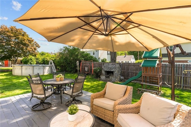 44 Felsmere Ave, Pawtucket, RI 02861 - view of patio / terrace with an outdoor pool, outdoor dining area, a playground, a deck, and an outdoor living space with a fireplace