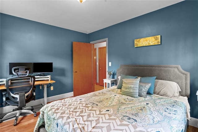 299 Buttonwoods Ave, Warwick, RI 02886 - bedroom with wood finished floors, a desk, and baseboards