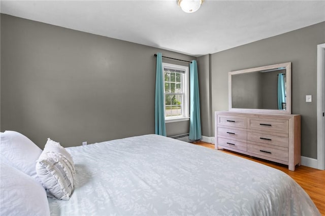 299 Buttonwoods Ave, Warwick, RI 02886 - bedroom with light wood finished floors and baseboards