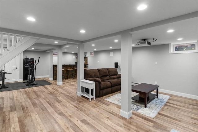 299 Buttonwoods Ave, Warwick, RI 02886 - living room with stairs, light wood-style flooring, baseboards, recessed lighting, and a baseboard heating unit