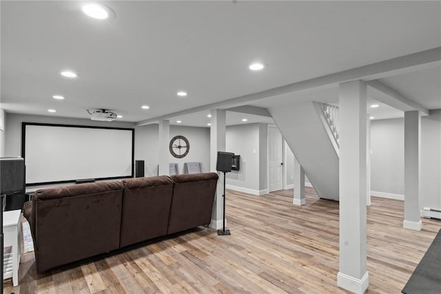299 Buttonwoods Ave, Warwick, RI 02886 - home theater room featuring light wood-style floors, recessed lighting, baseboards, and a baseboard heating unit