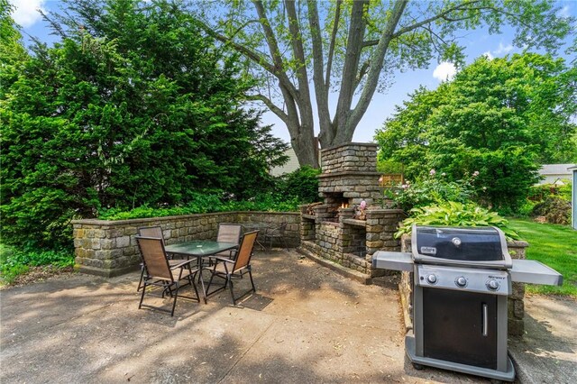 299 Buttonwoods Ave, Warwick, RI 02886 - view of patio / terrace featuring outdoor dining area, area for grilling, and an outdoor stone fireplace