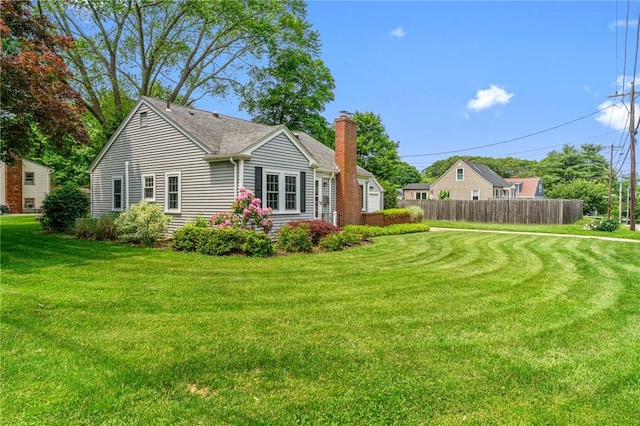 299 Buttonwoods Ave, Warwick, RI 02886 - view of home's exterior with a chimney