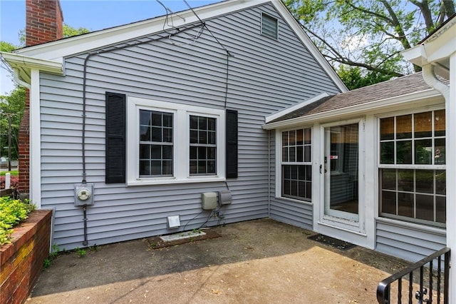 299 Buttonwoods Ave, Warwick, RI 02886 - view of side of home with a patio and a chimney