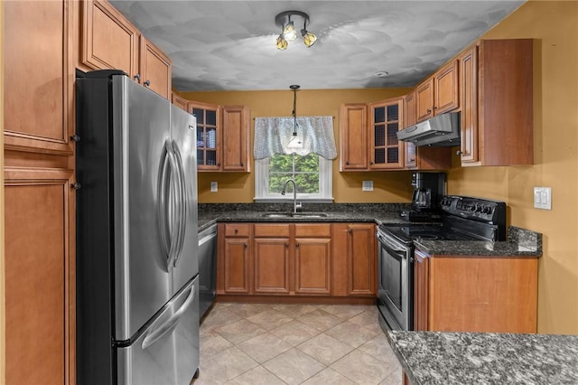 299 Buttonwoods Ave, Warwick, RI 02886 - kitchen featuring appliances with stainless steel finishes, under cabinet range hood, a sink, brown cabinetry, and glass insert cabinets