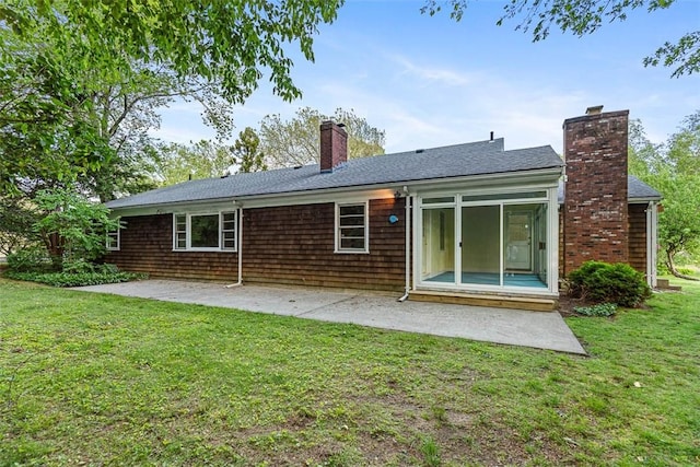 37 Beaumont St, East Providence, RI 02916 - rear view of property featuring a patio, a chimney, a lawn, and a shingled roof