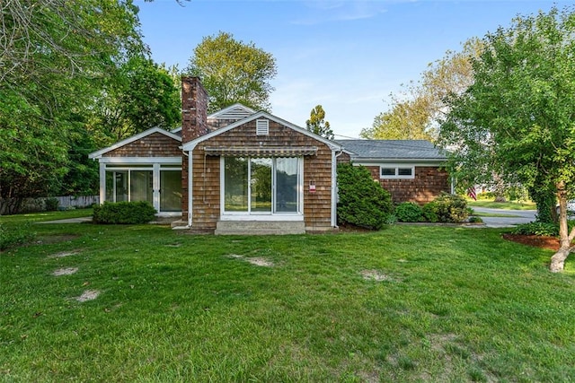 37 Beaumont St, East Providence, RI 02916 - rear view of house with a lawn and a chimney