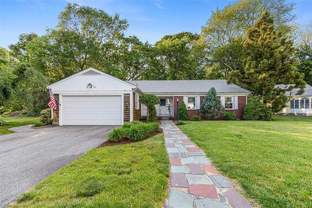 37 Beaumont St, East Providence, RI 02916 - ranch-style home with driveway, a garage, and a front lawn