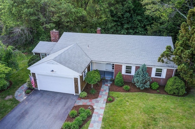 37 Beaumont St, East Providence, RI 02916 - view of front facade featuring a chimney, an attached garage, driveway, and a front lawn