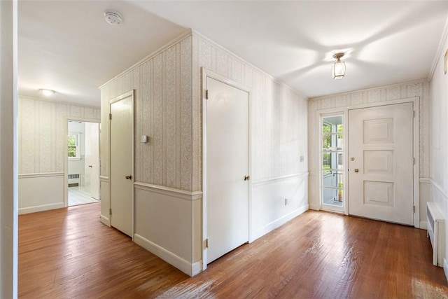 37 Beaumont St, East Providence, RI 02916 - foyer with wallpapered walls, wood finished floors, radiator, and baseboards