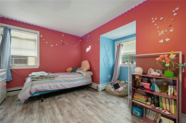 73 Vineyard Ave, Cumberland, RI 02864 - bedroom featuring wood finished floors, cooling unit, and baseboards