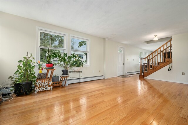 73 Vineyard Ave, Cumberland, RI 02864 - entryway with hardwood / wood-style floors, stairs, and a baseboard radiator