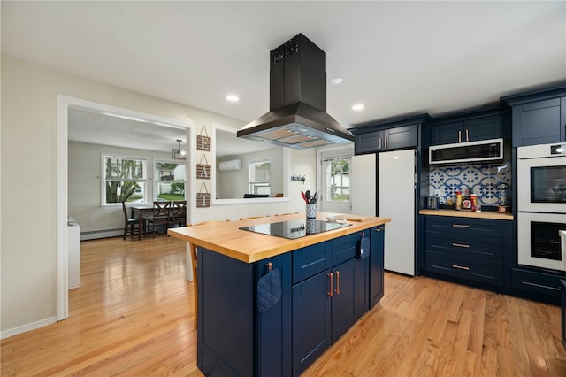 73 Vineyard Ave, Cumberland, RI 02864 - kitchen with wooden counters, island exhaust hood, white appliances, blue cabinetry, and light wood-style flooring
